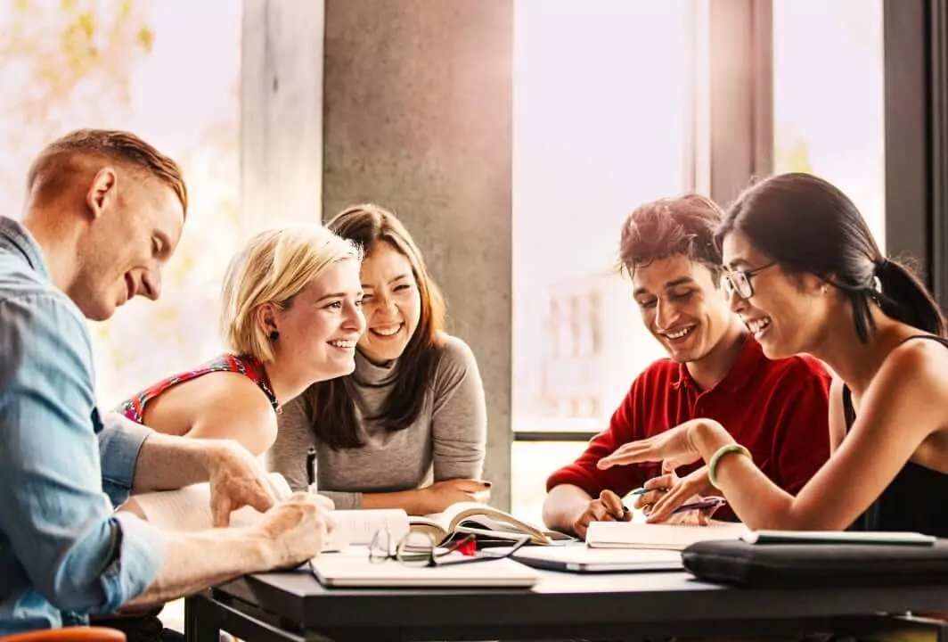 Four women and two men at the table
