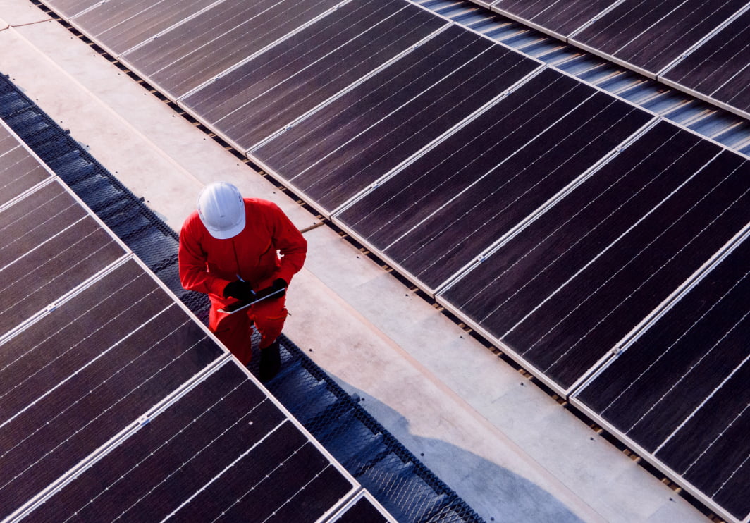 Solar engineer checking panels